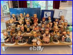 22 Goebel Hummels on BRAND NEW DISPLAY STAND- ALL MIB