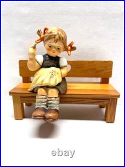 M I Hummel Goebel Nimble Fingers girl on wooden bench cross stitching HUM 758